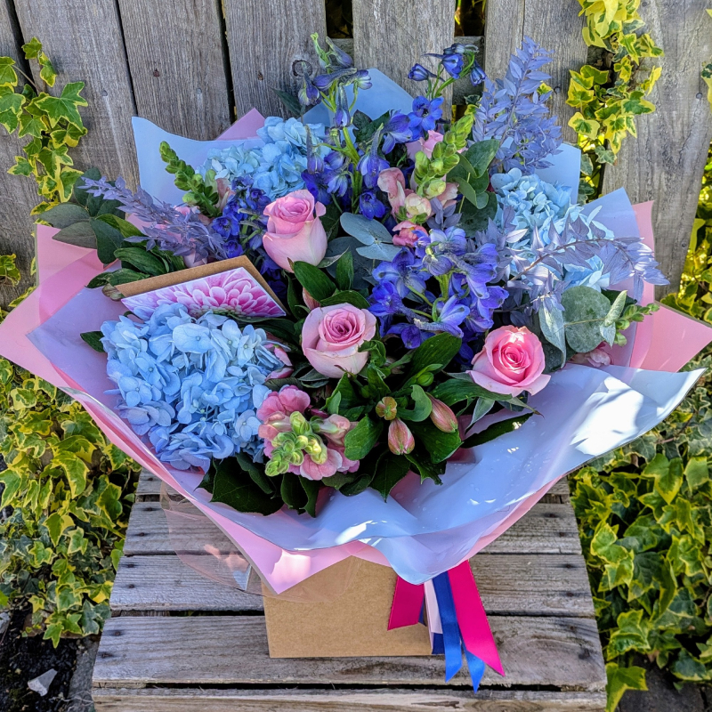 Blue and pink florist choice bouquet with hydrangeas and roses by Ruth Bowers Flowers