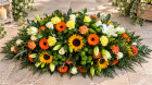 Funerals & Sympathy | Orange, yellow, green and white coffin spray