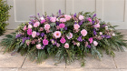 Funerals & Sympathy | Pink and purple spray with trailing foliage