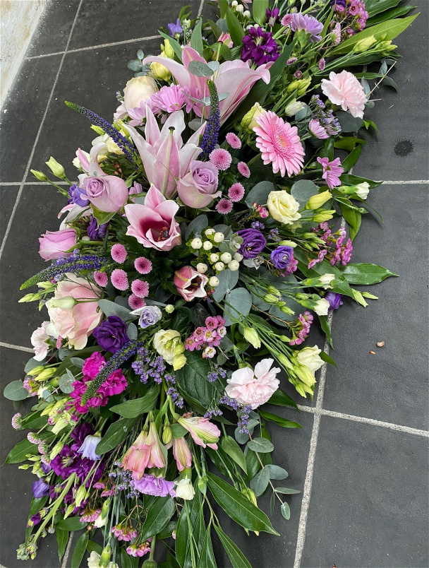 Casket sprays | Funeral Tributes | Pink, lilac & purple coffin spray