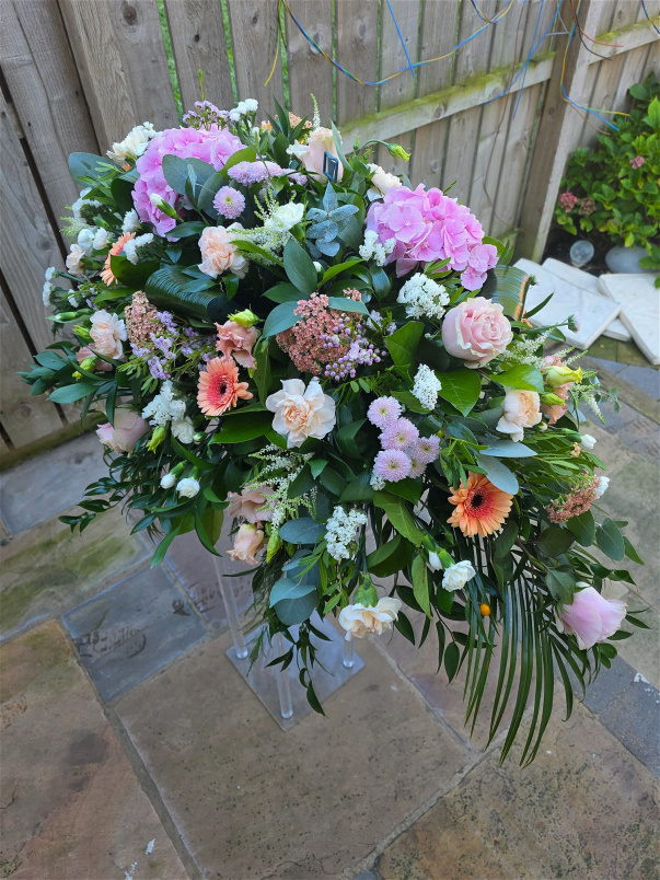 Funeral Tributes | Pink & Peach Casket Spray