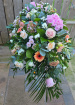 Funeral Tributes | Pink & Peach Casket Spray