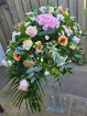 Funeral Tributes | Pink & Peach Casket Spray