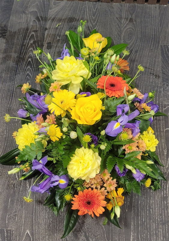 Funeral Flowers | Funeral Sprays | Bright teardrop spray.