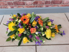 Funeral Flowers | Funeral Sprays | Bright teardrop spray.