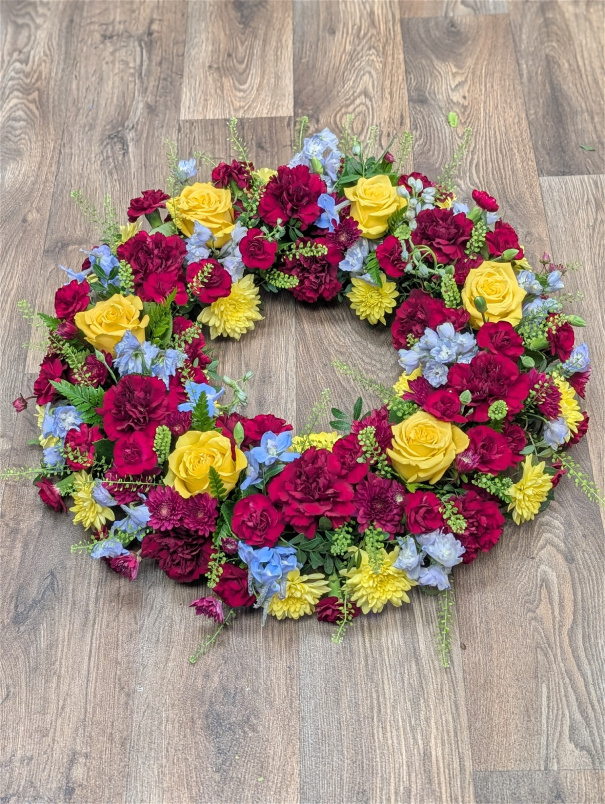 Funeral Flowers | Funeral Wreaths | Burgandy, yellow and blue wreath