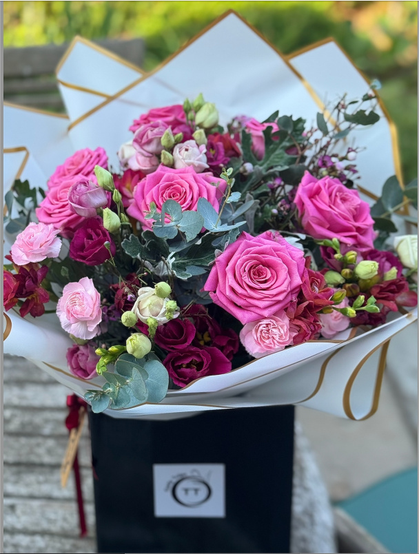 Bouquets | Gifts | Blossoming Love: A vibrant, colorful arrangement featuring seasonal flower