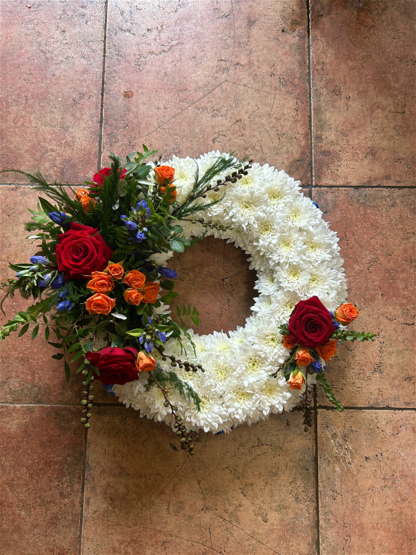 Wreaths  | Classic Massed Wreath ~ With orange And Red Spray With A Touch Of Blue