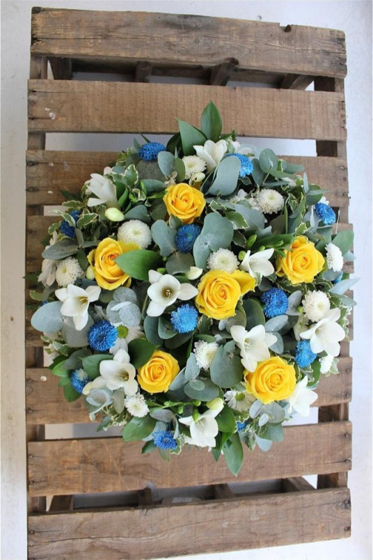 Funeral tributes | Classic yellow roses and white freesia