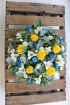 Funeral tributes | Classic yellow roses and white freesia