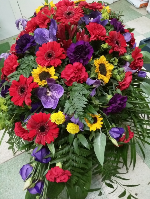 Funeral tributes | Purple and Red coffin spray