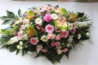 Funeral tributes | Pink coffin spray