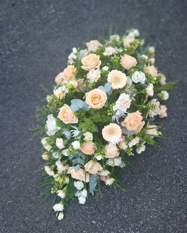 Funeral tributes | Peach, white & cream casket spray