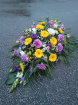 Funeral tributes | Coffin Spray: yellow and purple