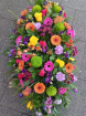 Funeral tributes | Vibrant casket spray