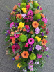 Funeral tributes | Vibrant casket spray