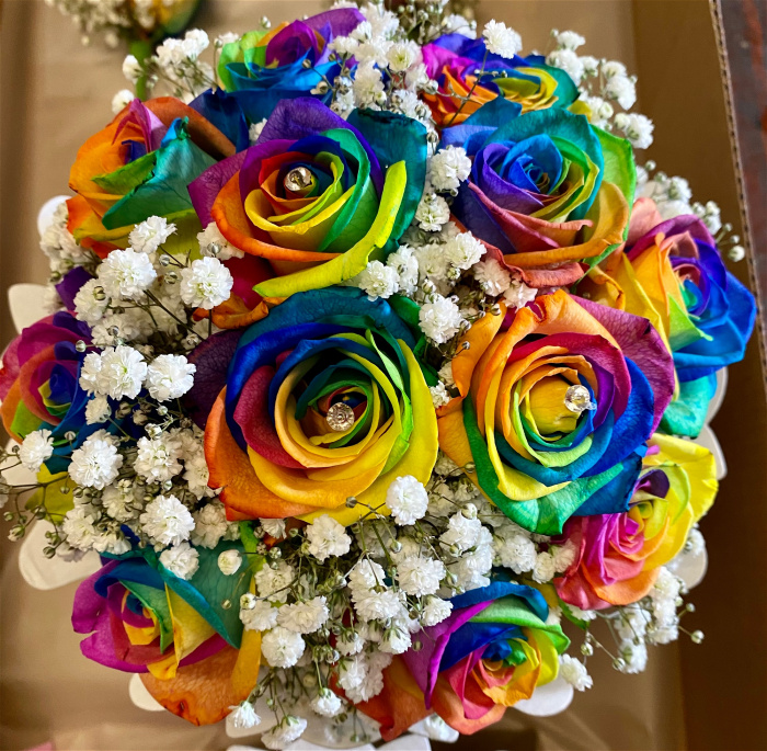 Weddings | Bridal bouquet of rainbow roses.